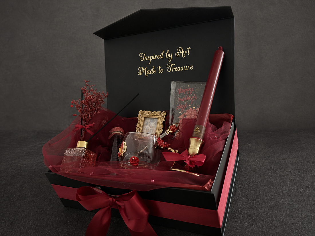 Open Klimt The Kiss gift box with glass cup, burgundy candle and framed print, a Christmas gift for an art lover