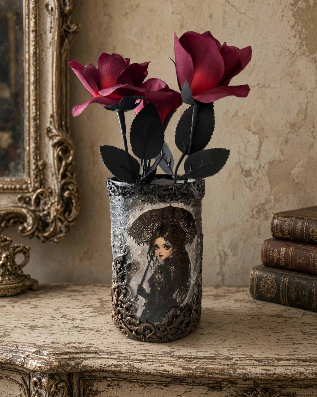Gothic decoupage glass vase showing a girl with a black lace parasol, crackled gray-white texture and red roses on a vintage table