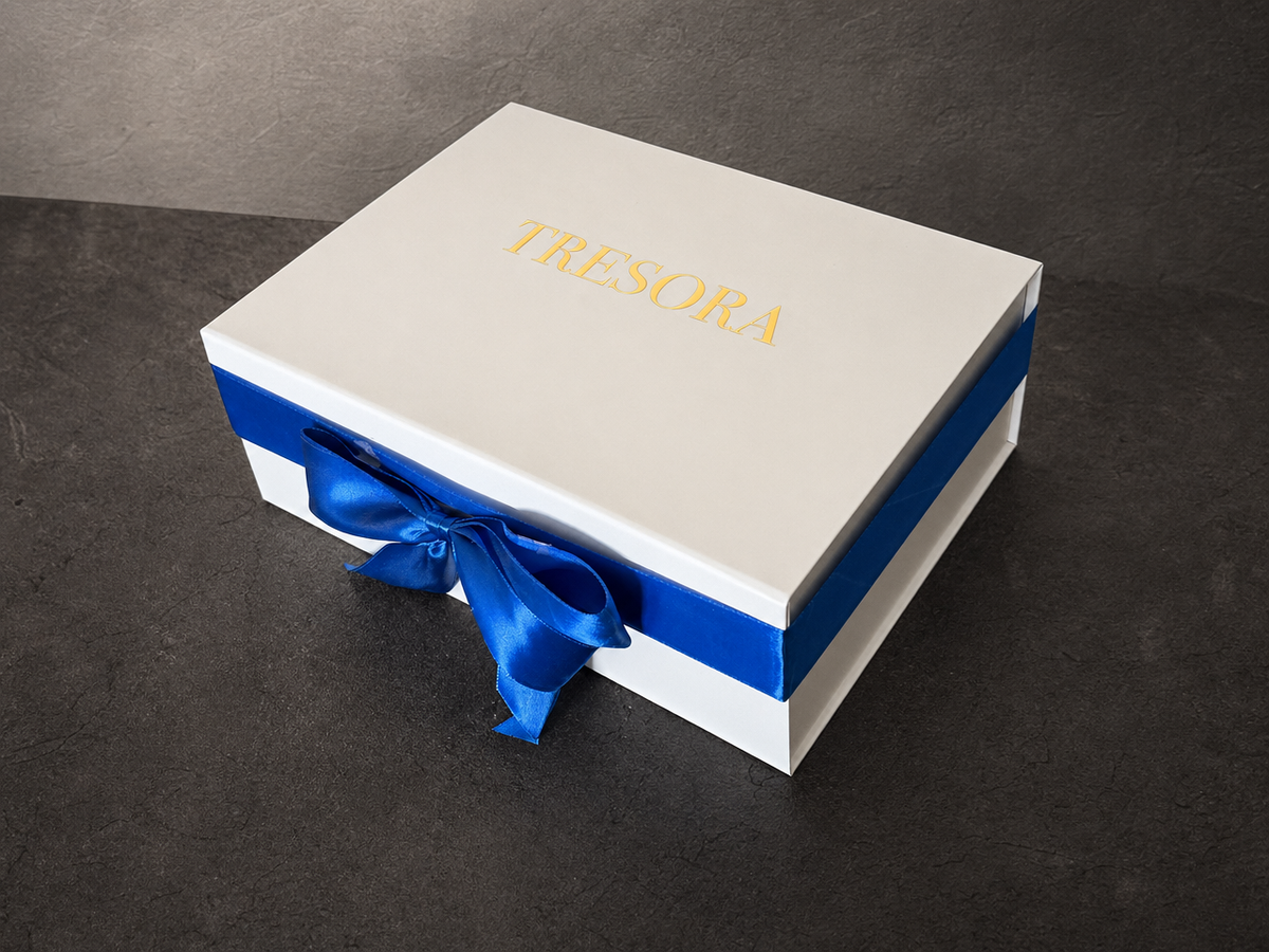 Closed white Van Gogh Almond Blossom gift box with blue stripe and satin bow